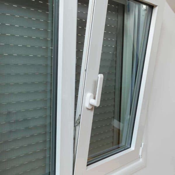 Technician installing home window glass